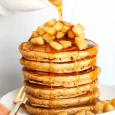 Light and fluffy Healthy Apple Cinnamon Pancakes made with whole wheat flour, applesauce in place of oil and zero butter or refined sugar! Topped with warm spiced apples and drizzled with maple syrup!
